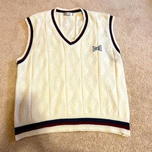 An oversized vest with stripes along edges